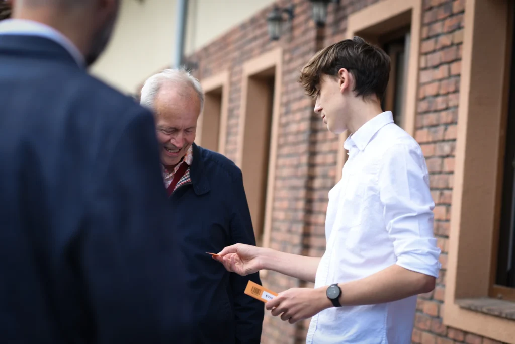 A young man talking with a passer-by on a Bratislava street during a Christian Centre outreach