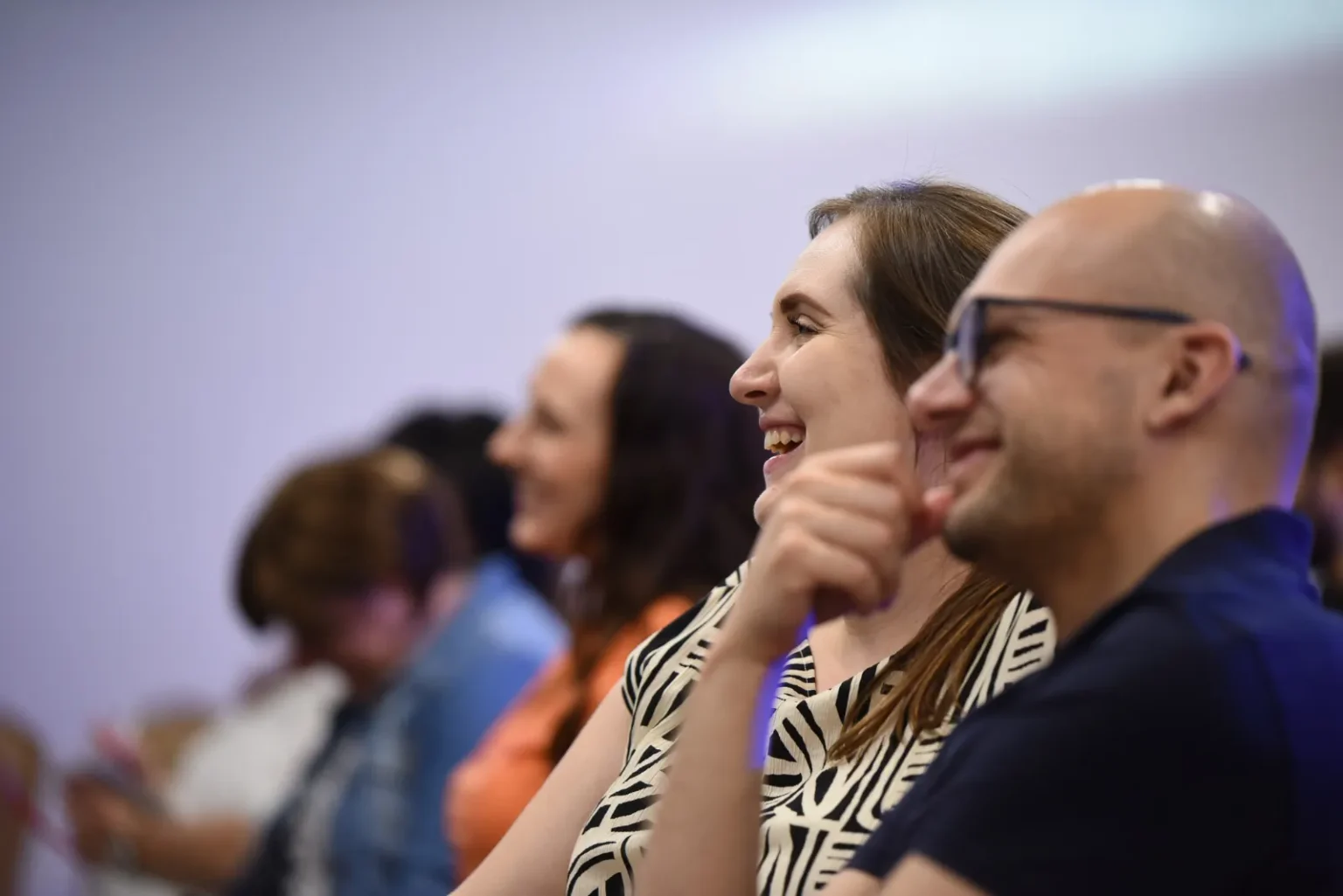 People laughing during a sermon at Christian Centre Bratislava